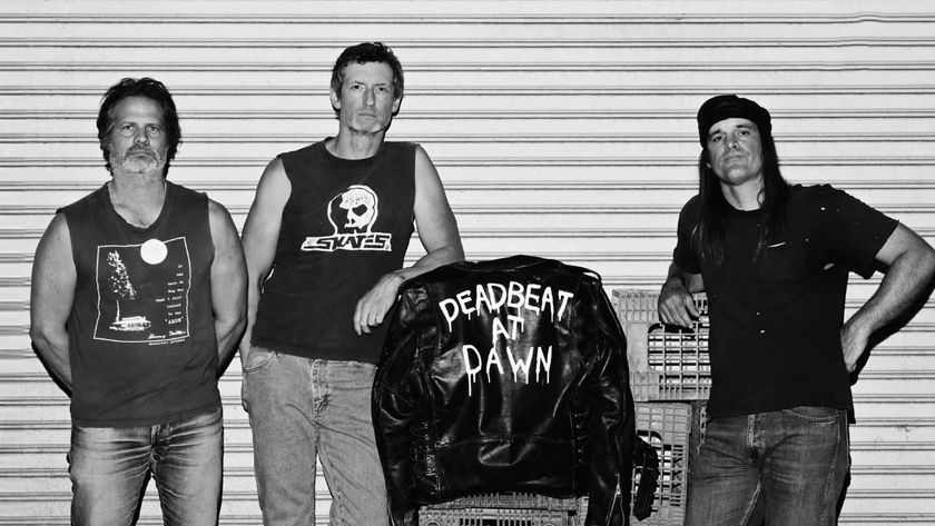 Zig Zags standing against a metal shutter