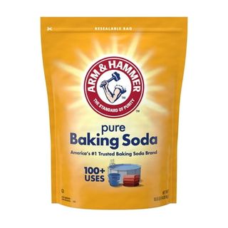 A yellow plastic resealable packet of arm and hammer baking soda