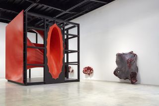 Installation view of Anish Kapoor's Museo d'Arte Contemporanea Roma, including the artist's enormous red sculpture, Sectional Body Preparing for Monadic Singularity