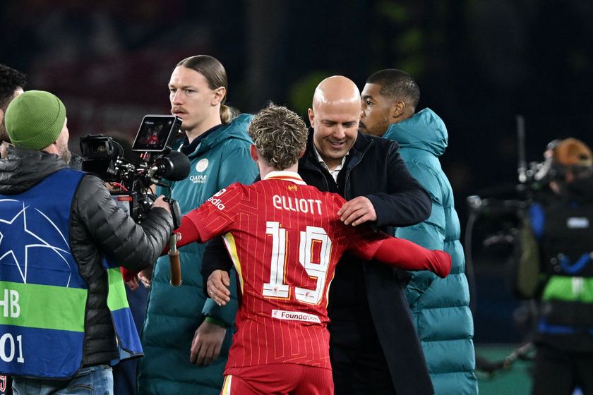 Arne Slot, Manger of Liverpool, greets player Harvey Elliott after the UEFA Champions League 2024/25 Round of 16 first leg match between Paris Saint-Germain and Liverpool FC at Parc des Princes on March 05, 2025 in Paris, France.