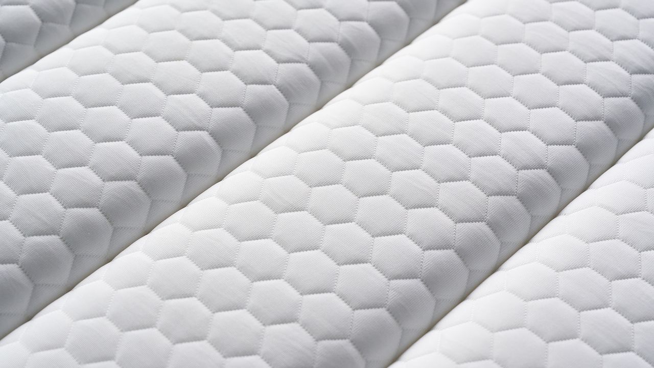 A close up of white pillow top surface of Brooklyn Bedding CopperFlex
