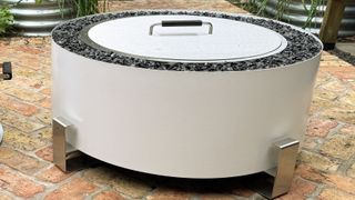 Breeo Luxeve Fire Pit out of the box with lid on in reviewer's backyard