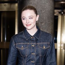 Chloe Grace Moretz wearing dark denim and Louis Vuitton express bag