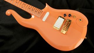 An orange Prince Cloud guitar replica, built by Dave Rusan