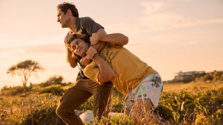 Chase Stokes being choked and dragged by a guy in Outer Banks