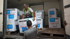 Aid workers unload polio vaccine for Gaza