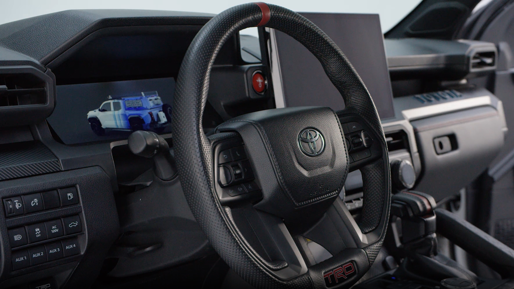 A Tacoma H2-Overlander truck in a studio