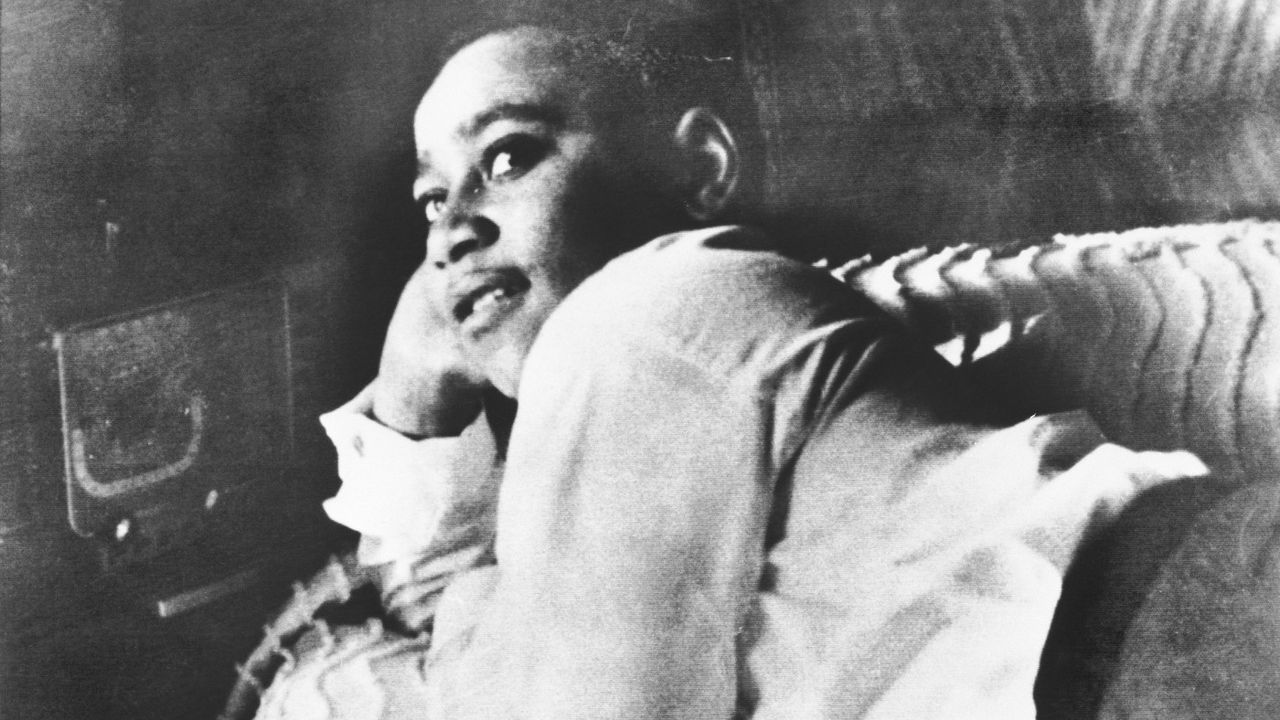 Emmett Till lying on a bed