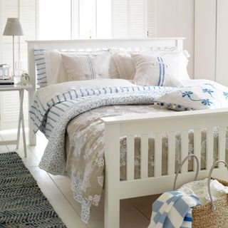 bedroom with white walls and white flooring