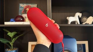 Beats Pill speaker in red and Sonos Roam 2 speaker in blue