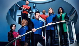The Orville crew posed on the ship's stairs
