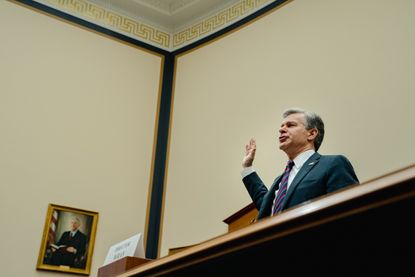 FBI Director Christopher Wray raises his hand to be sworn into a House Judiciary Committee hearing