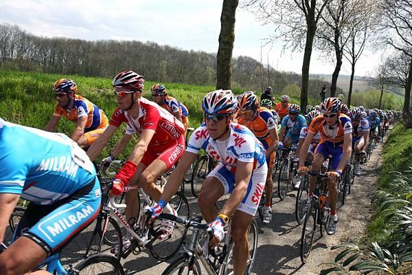 The peloton rides three wide down some of the narrow sections of the route.