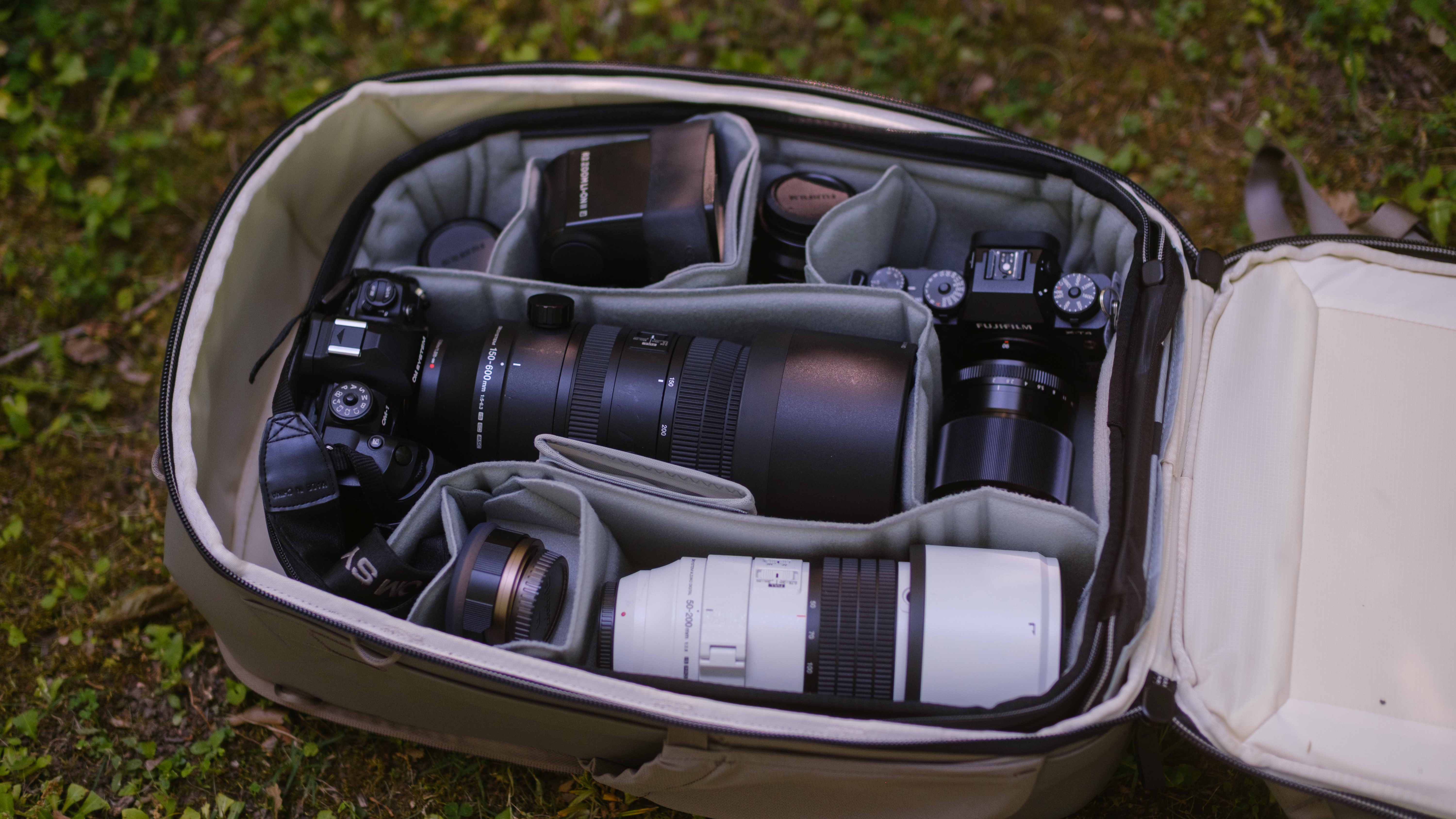 The Peak Design Travel 2-in-1 Backpack outdoors used by a photographer