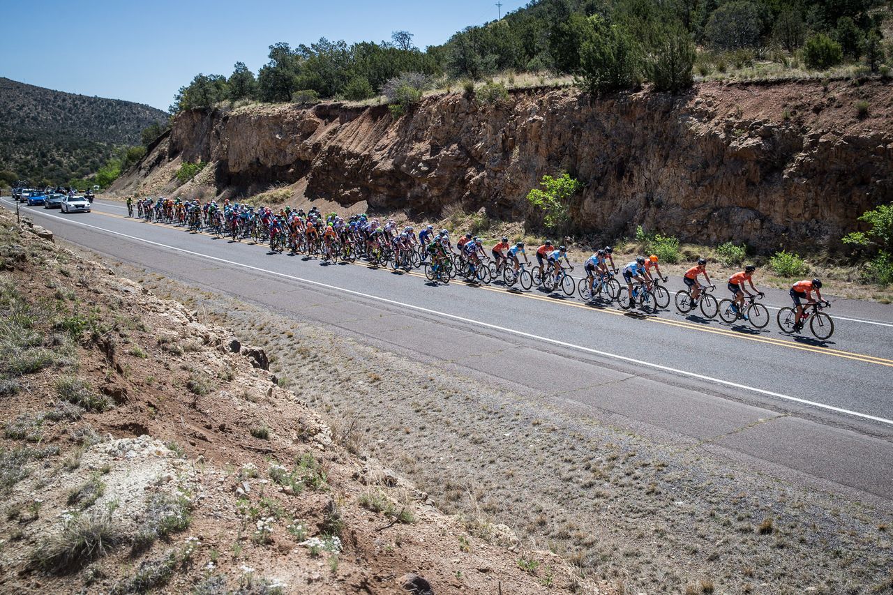 The front of the field stays strung out chasing the break.