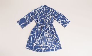 A blue dress with a white pattern on it.