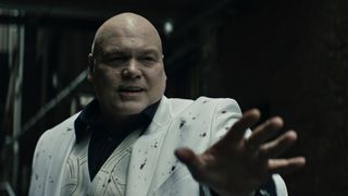 A blood-stained Wilson Fisk reaches out to someone in Marvel Studios' Echo