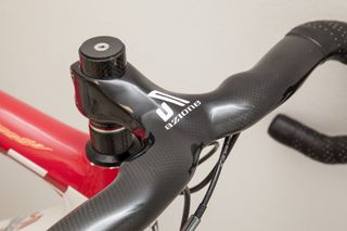 The one piece handlebar and stem is Azione branded