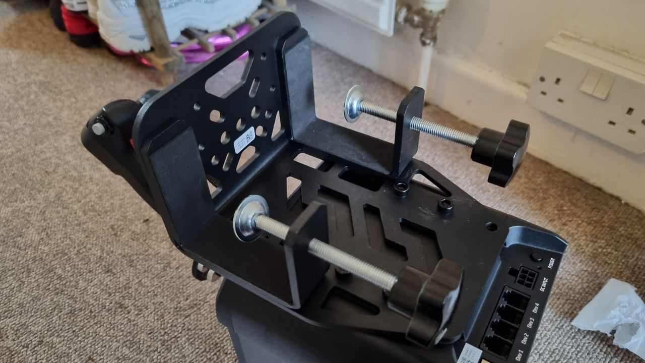 A desk clamp attached to a Moza AB9 FFB base