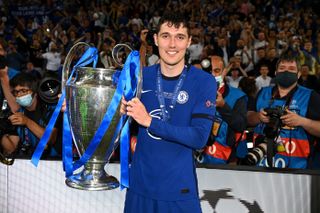 Andreas Christensen celebrates with the Champions League trophy after Chelsea's win over Manchester City in the final in May 2021.