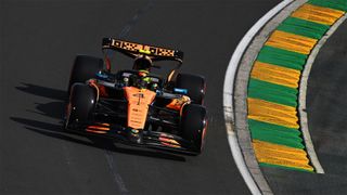 Lando Norris driving around a bend during practice for the 2025 Australian Grand Prix