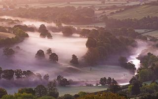 Mist lingers in the Usk Valley at dawn in autumn, Brecon Beacons National Park, Powys, Wales, United Kingdom, Europe