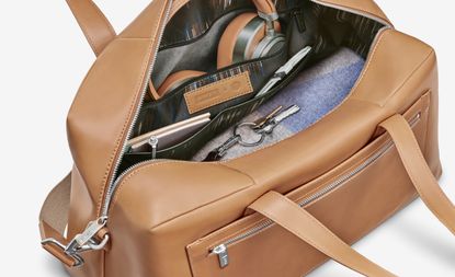 The collection’s ‘Everywhere Bag’ in leather, and MW65 Active Noise-Cancelling wireless headphones