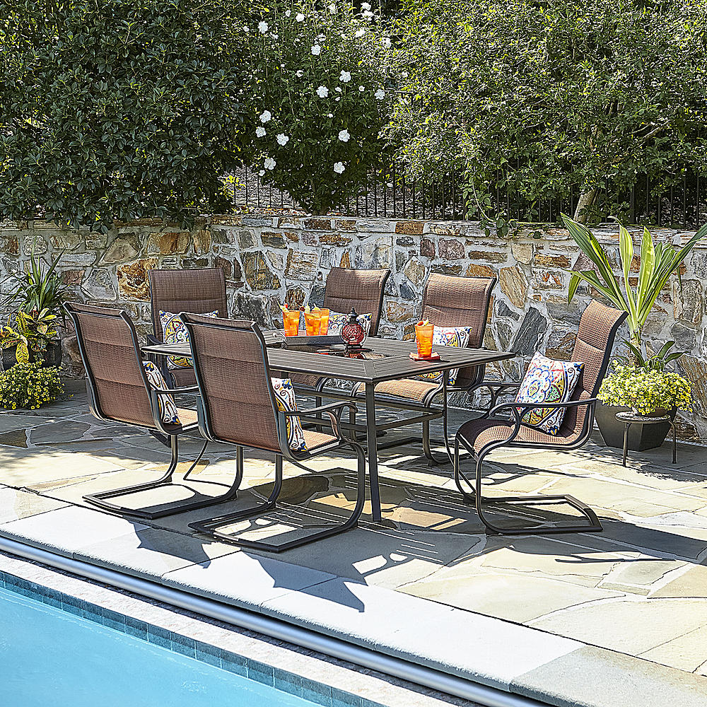 garden furniture set by a swimming pool