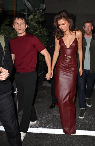 Tom Holland and Zendaya leave the Bero launch party wearing matching burgundy outfits