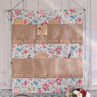 fabric seed calender hanging on wall in shed