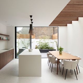contemporary kitchen extension with kitchen island and dining table
