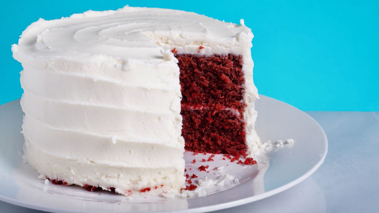 Rachel Allen&#039;s red velvet cake, iced with one slice taken out