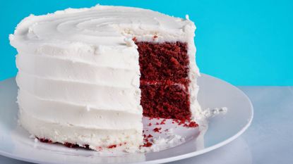 Rachel Allen's red velvet cake, iced with one slice taken out