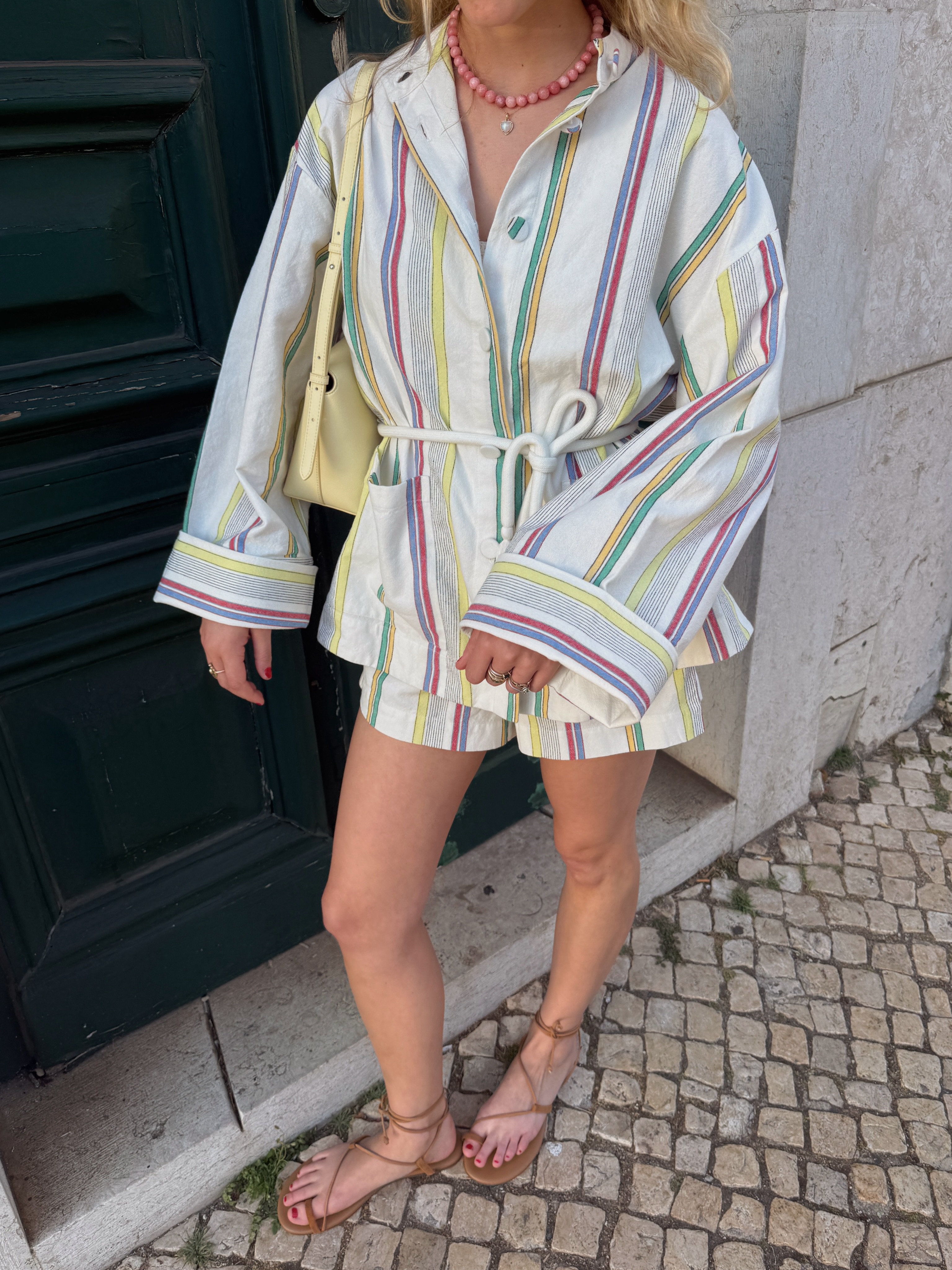 An image of a woman wearing lace up sandal outfit summer 2026