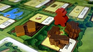 Photographs of the Agricola board game in play