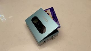 FiiO CP13 cassette player in blue with cassette tape