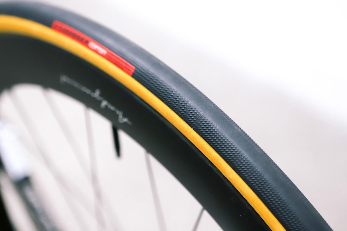 A tan bicycle tyre on a white background