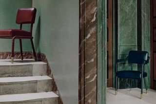 The Easton Side Chair (left) and Dining chair (right) crafted from stainless steel and Italian leather available in a colour palette that ranges from red and navy blue (pictured) to yellow and green. ’A refreshing look at a Traditional Design, the chair harks back to mid-century design influences,’ say the designers