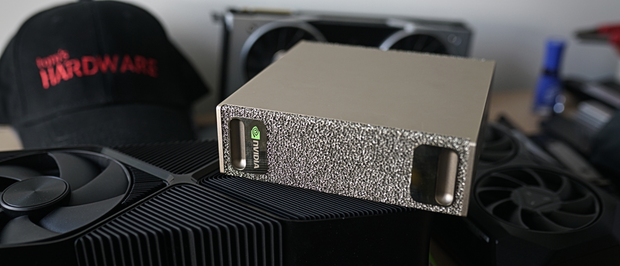 A DGX Spark sitting on top of a graphics card.