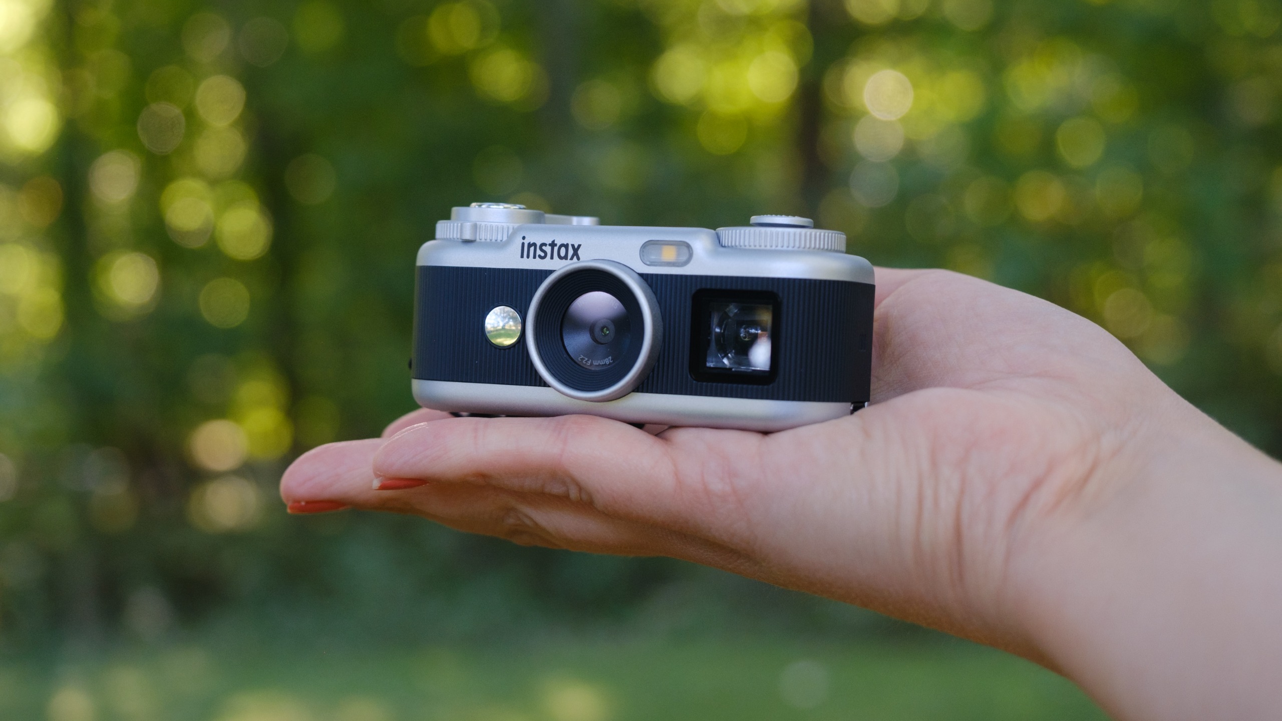 The Instax Pal 2 in a photographer's hands