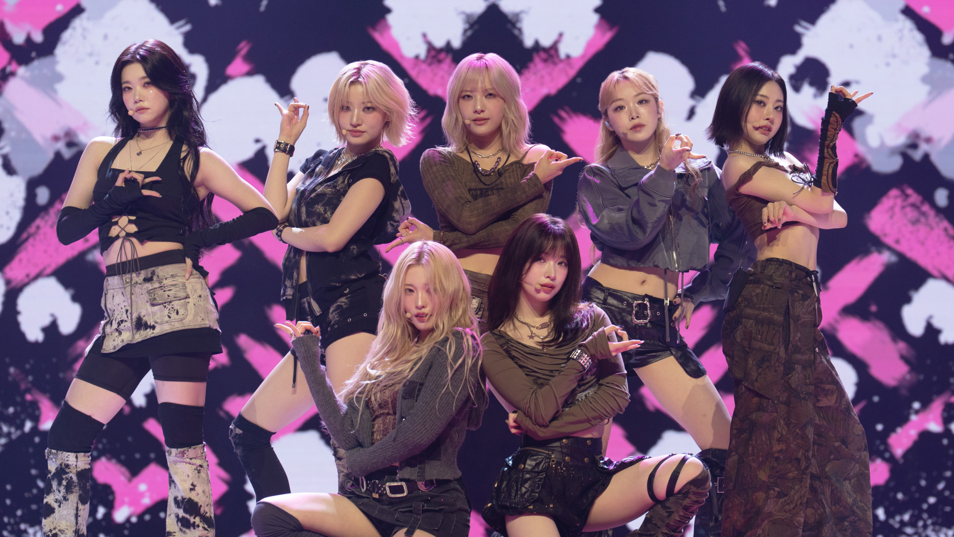 The seven members of Billlie (from left: Tsuki, Siyoon, Haram, Moon Sua, Haruna, Suhyeon, and Sheon) perform in front of an LED screen, on Apple TV+'s 'KPOPPED.'