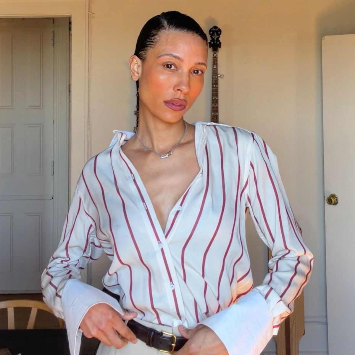 Influencer @tylynn wearing a red and white striped shirt