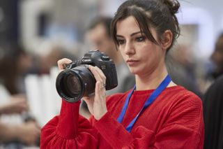 Woman trying out Canon SLR at TPS 2018