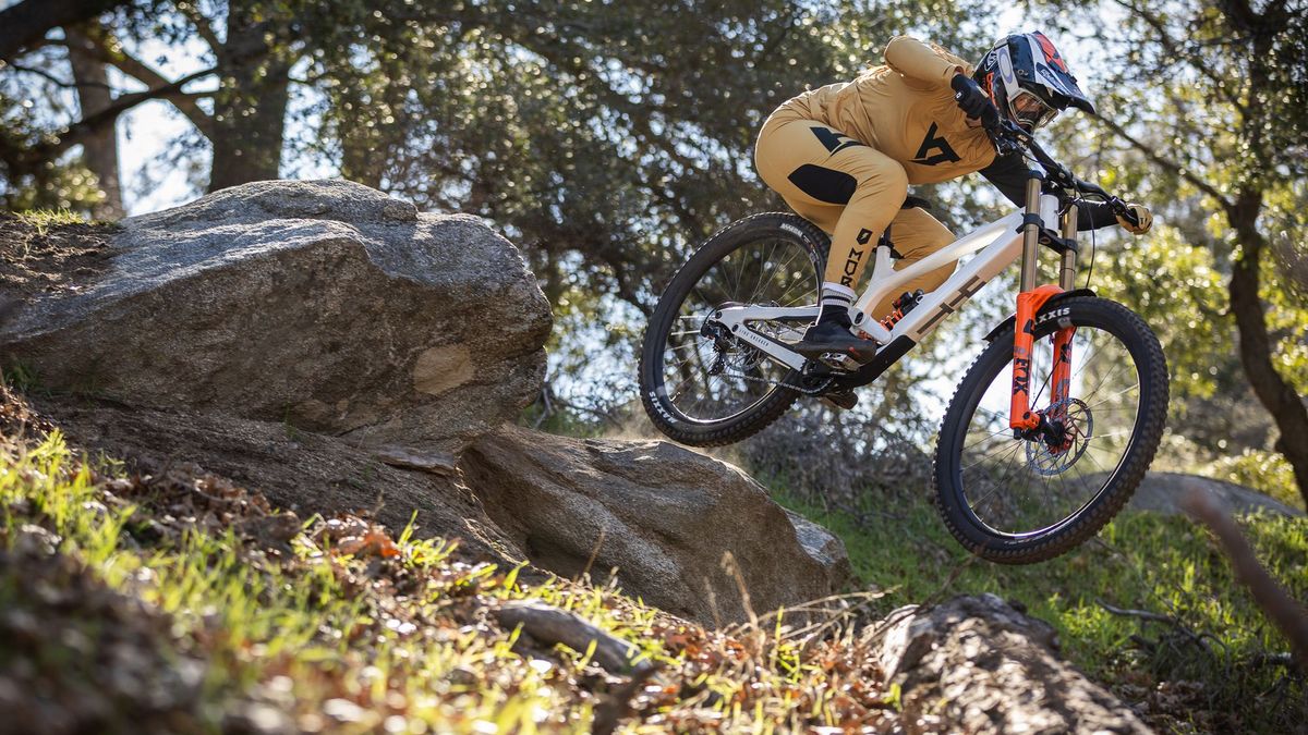 YT Industries Tues being ridden down a rock trail