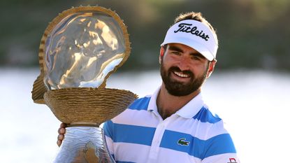 Antoine Rozner poses with the trophy after winning the 2021 Qatar Masters