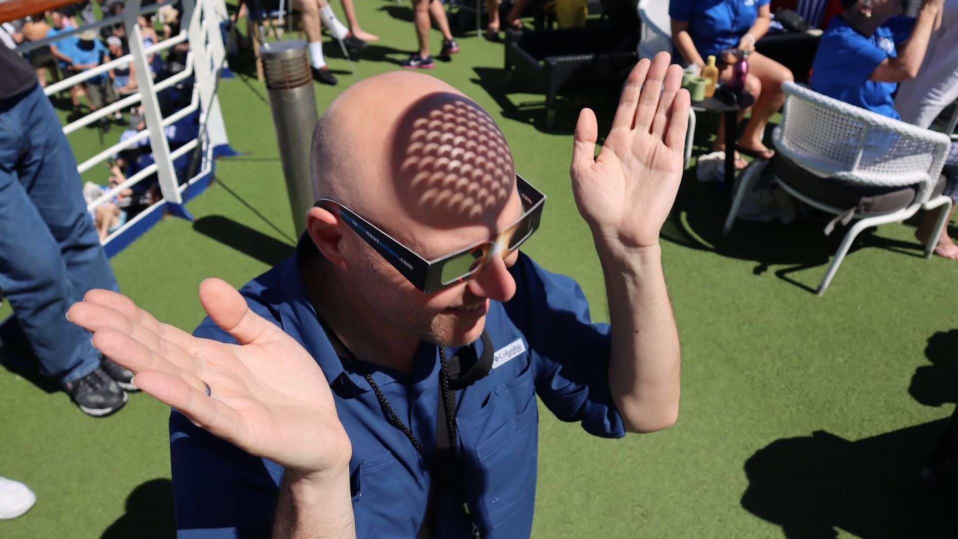 Shadows showing crescent suns photographed on a man's head
