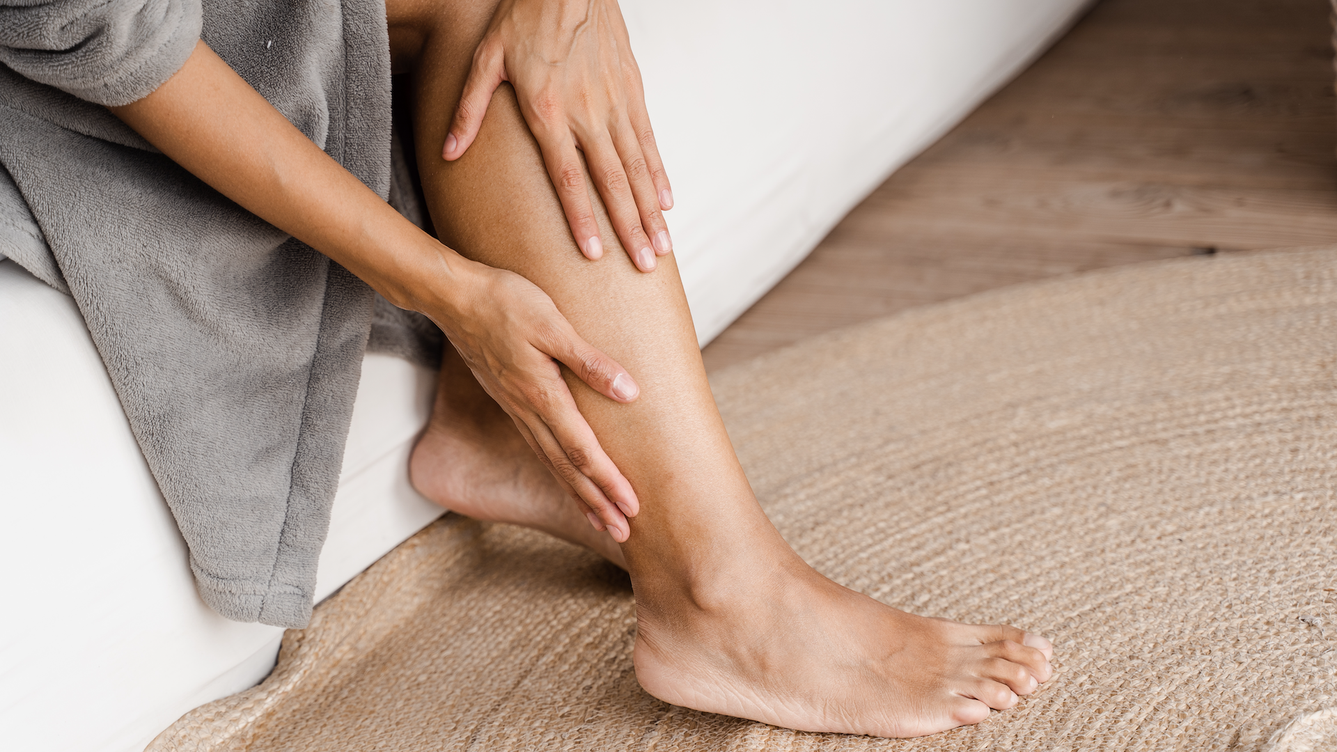 Woman holding her leg