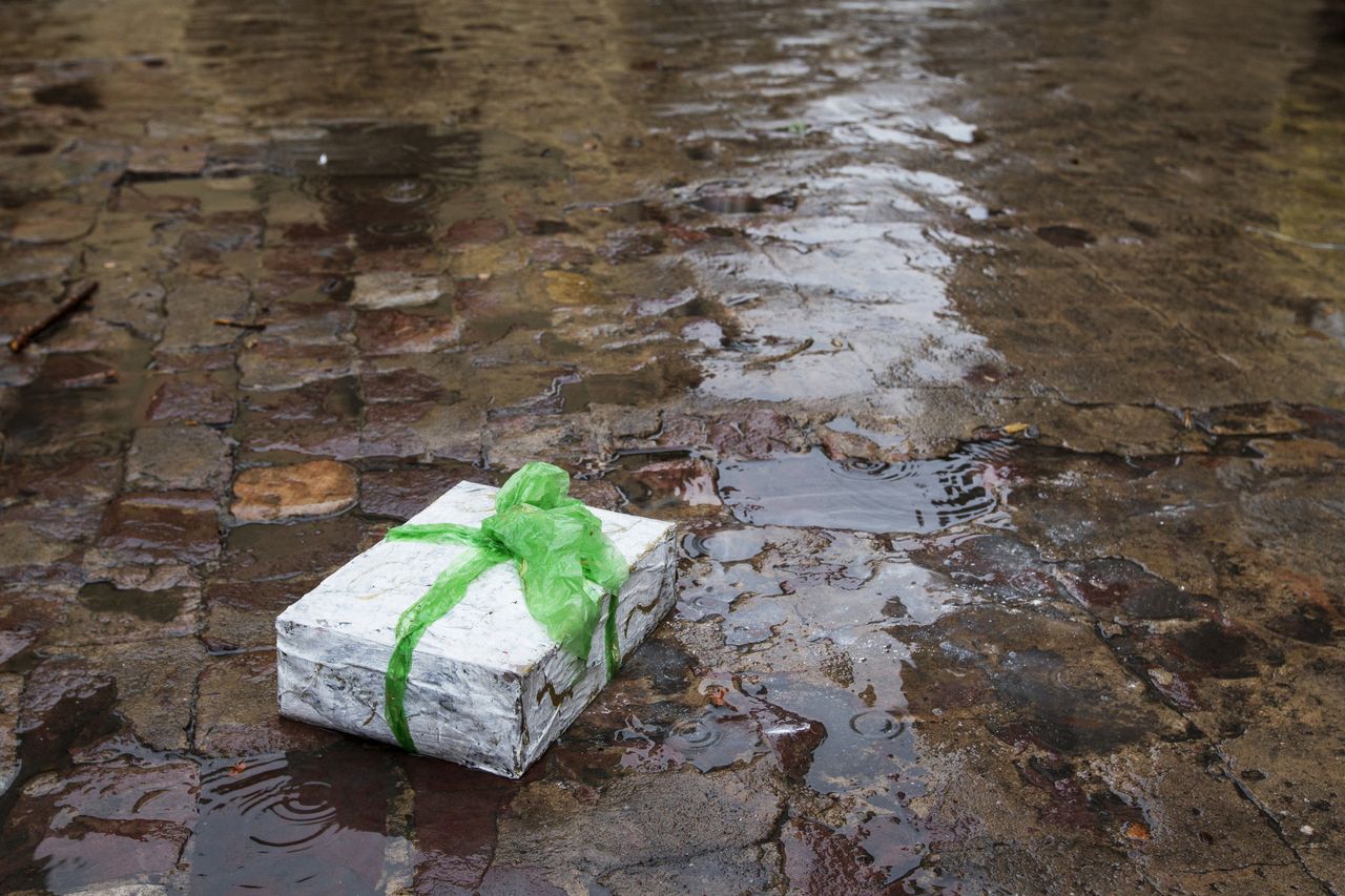 Gift abandoned on the street in a rainy day,