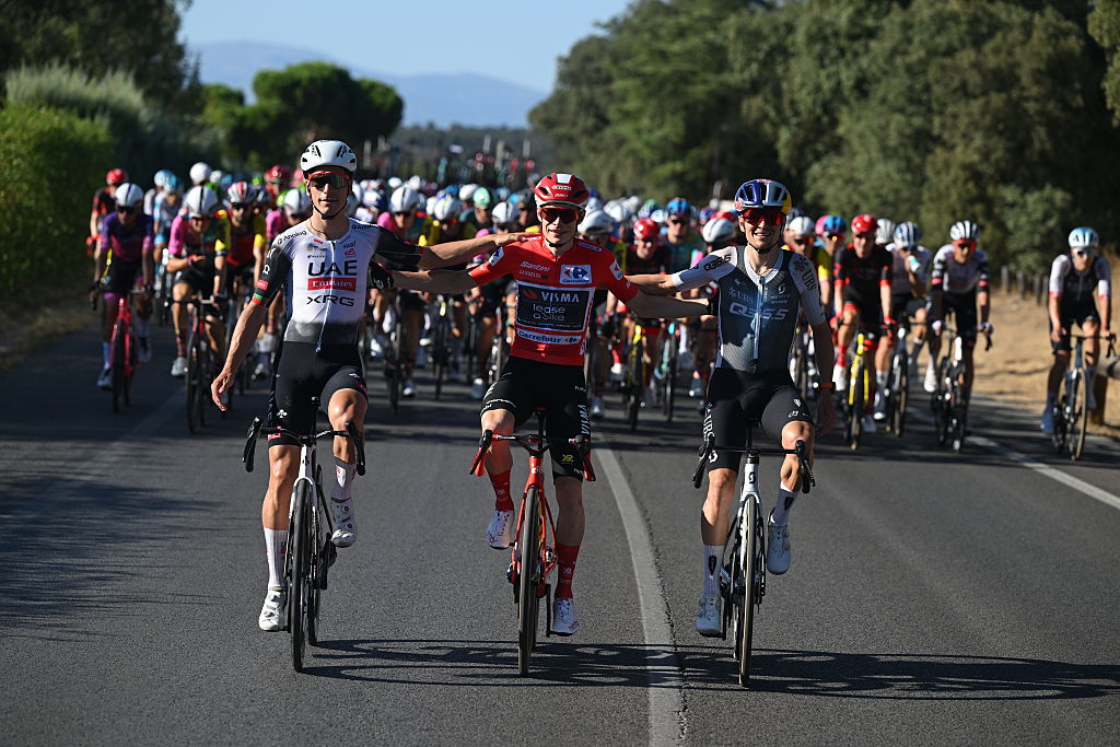 MADRID, SPAIN - SEPTEMBER 14: (L-R) Joao Almeida of Portugal and UAE Team Emirates - XRG on second place, race winner Jonas Vingegaard of Denmark and Team Visma | Lease a Bike - Red Leader Jersey and Thomas Pidcock of Great Britain and Team Q36.5 Pro Cycling on third place winner compete during the La Vuelta - 80th Tour of Spain 2025, Stage 21 a 108km stage from Alalpardo to Madrid / #UCIWT / on September 14, 2025 in Madrid, Spain. (Photo by Dario Belingheri/Getty Images)