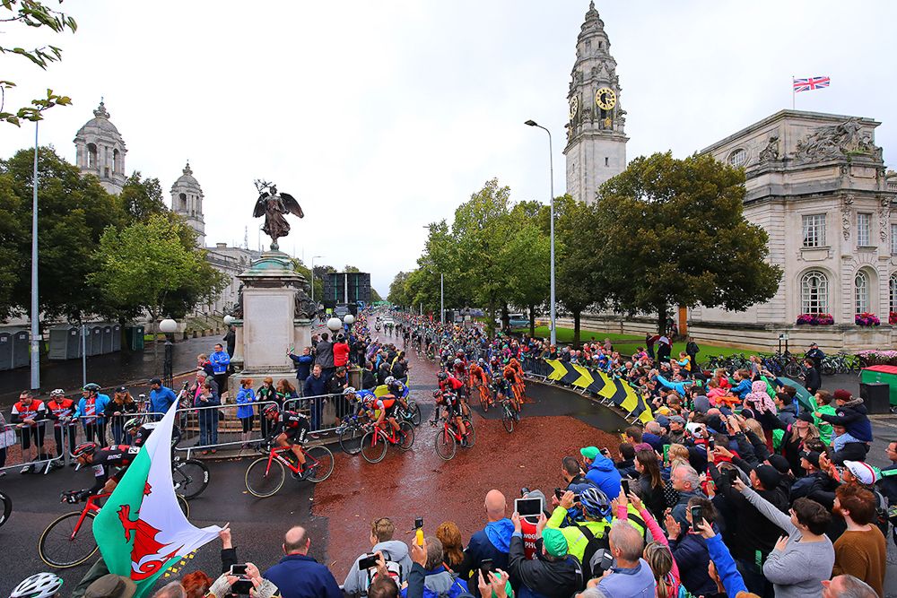 The peloton rolls by big crowds in Cardiff during stage 8 at the Tour of Britain